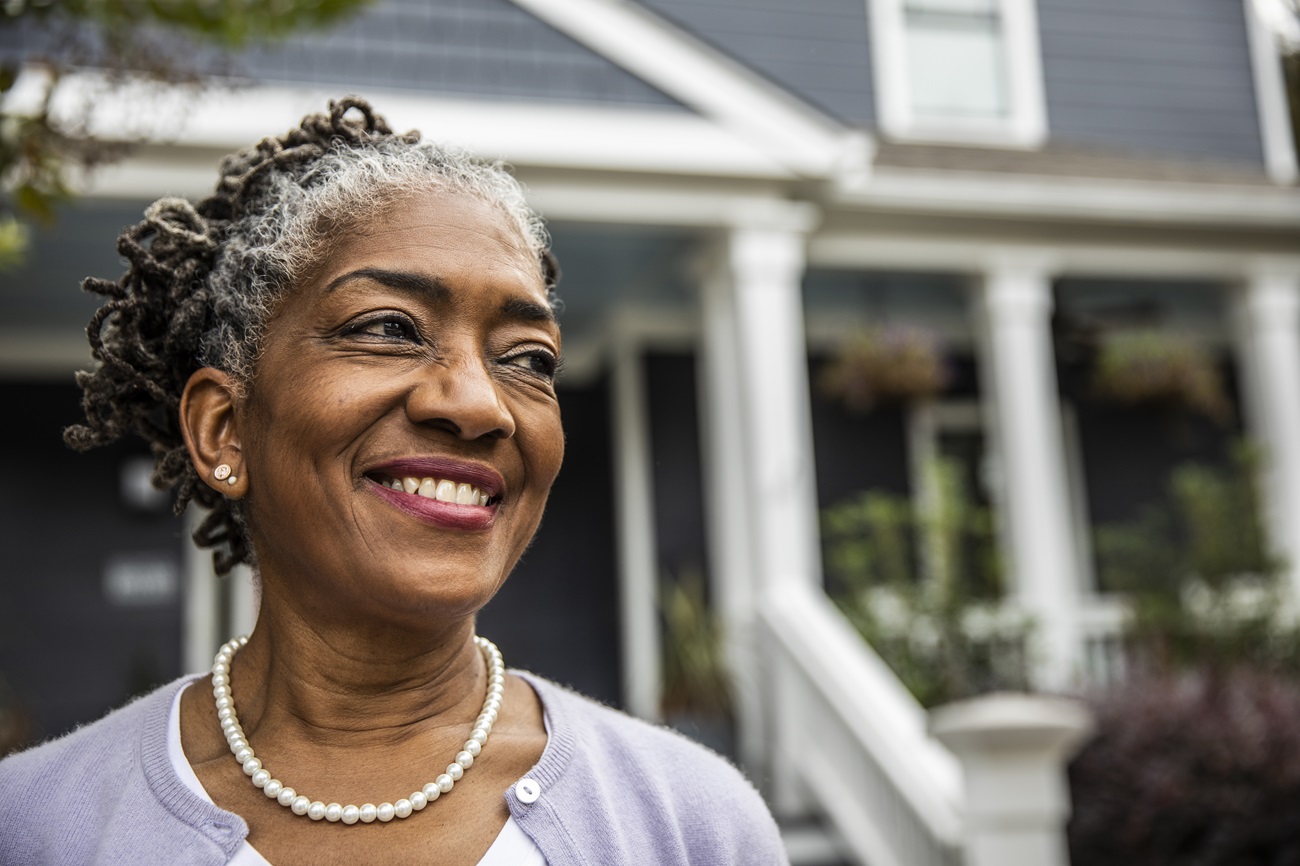 Woman outside her home