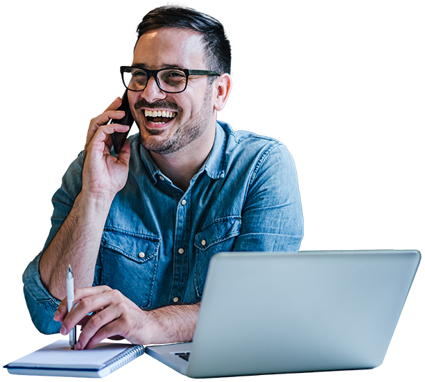 1-2-1Brokers Man talking on phone laughing while at computer